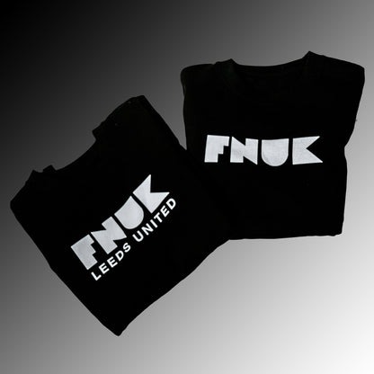 FNUK-logo med Leeds United-genser for kvinner i svart og hvitt