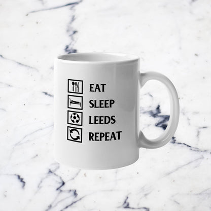 Leeds United Eat, Sleep, Leeds, Repeat Taza 11oz en blanco